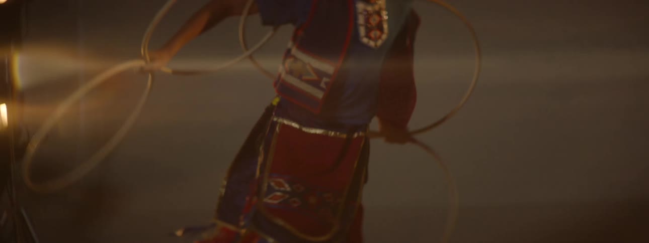 Girl in traditional indigenous clothing dancing in a performance