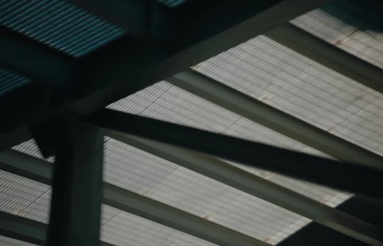 The vehicle drives up the metal ramp