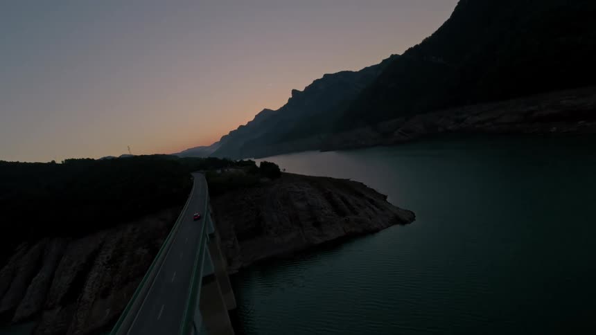 The car drives over the bridge on the peninsula
