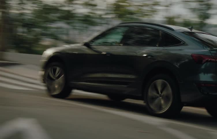 Man driving a vehicle on a road during the day