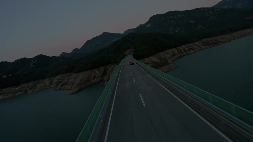 A car drives over a bridge