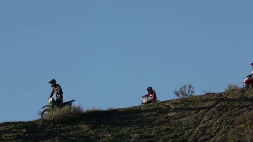 People riding dirt bikes