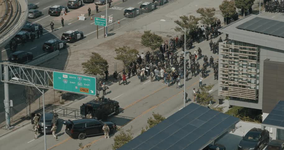 Police and people are gathered on a highway
