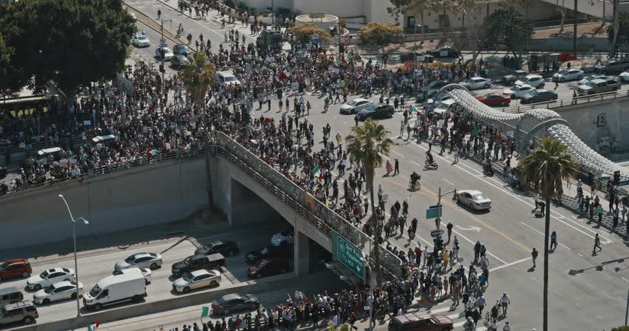Protesters walk down the ramp onto the freeway