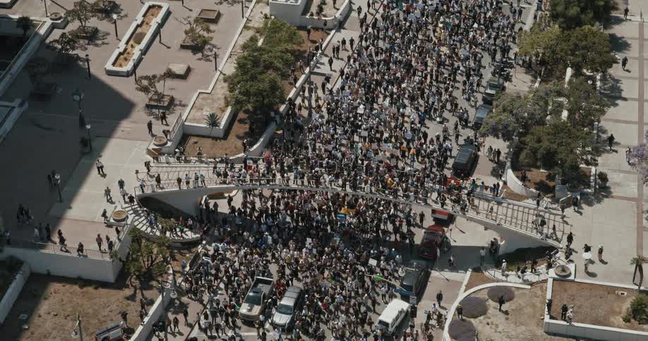 The large group of protesters march on the freeway