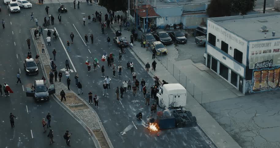 Protesters closing a street on an urban road