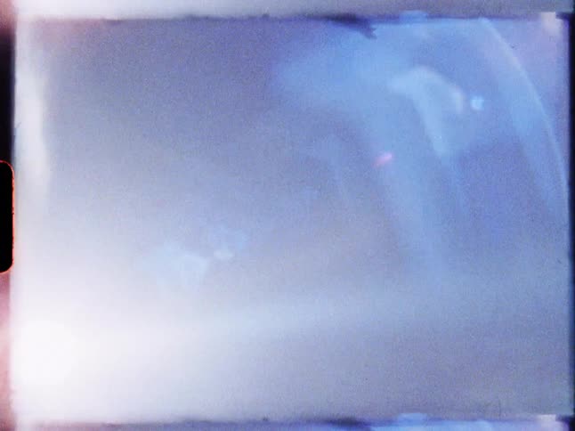 A bright white light hitting the blue environment randomly and with some flares