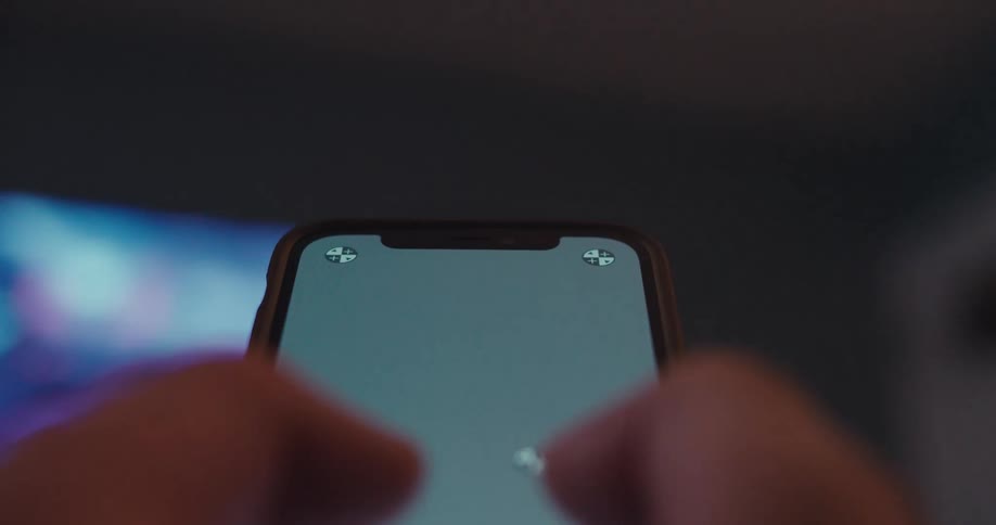 Pair of hands typing on a smartphone