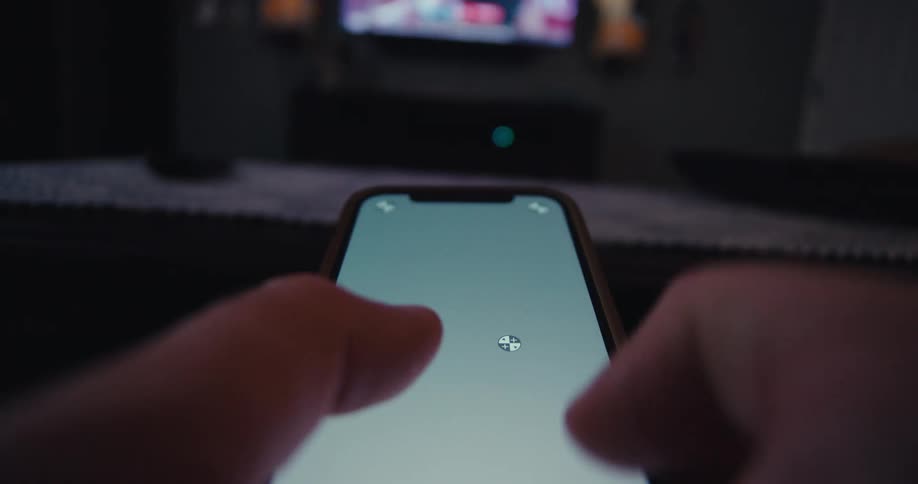A person is typing on their cell phone