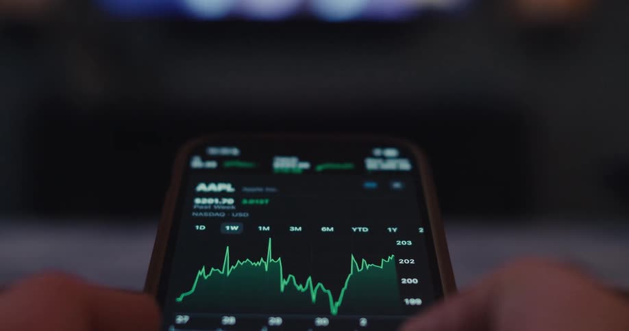 Person scrolls through stock information on a smartphone
