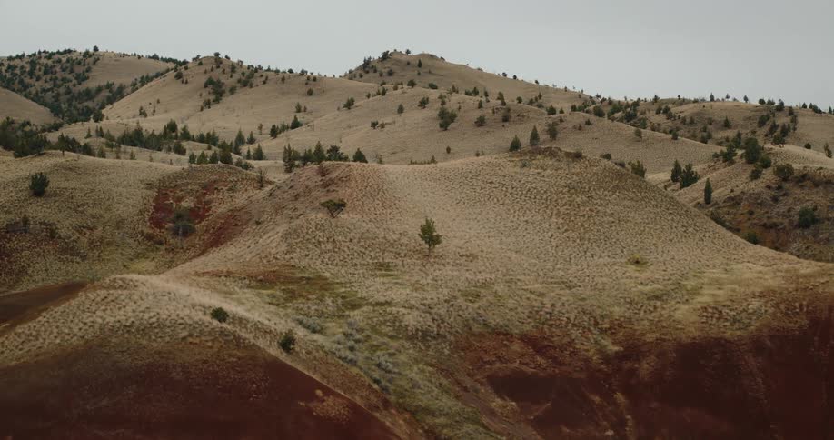 Flying over a desert with sandy hills