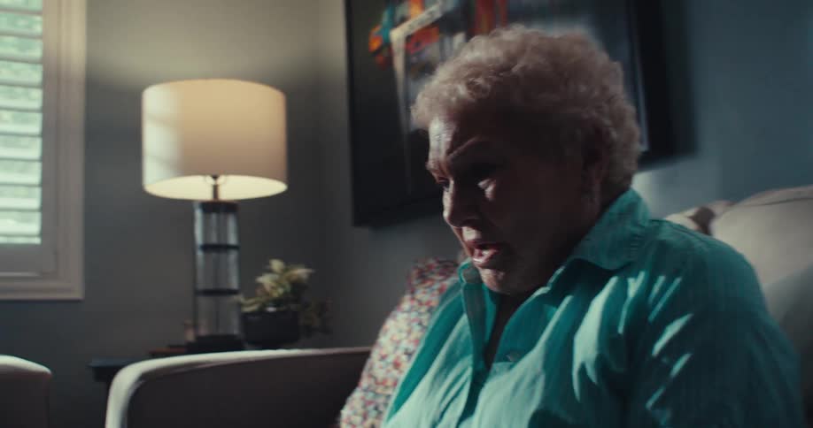 A woman is angry as she talks to her tablet