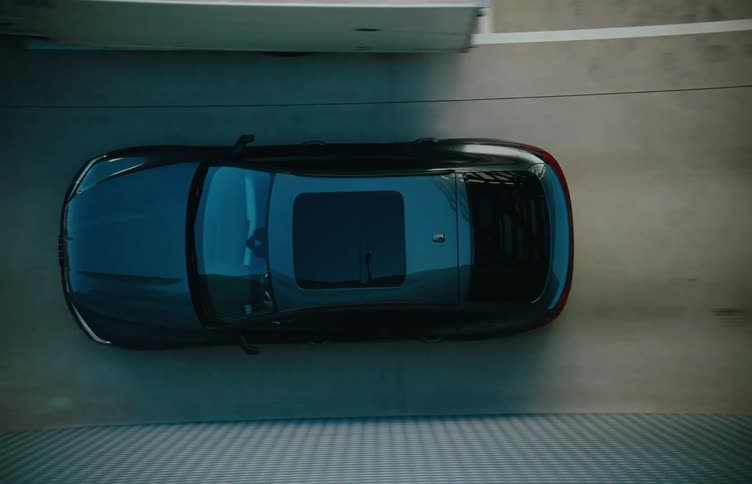 Aerial of a car driven into a building garage during the day