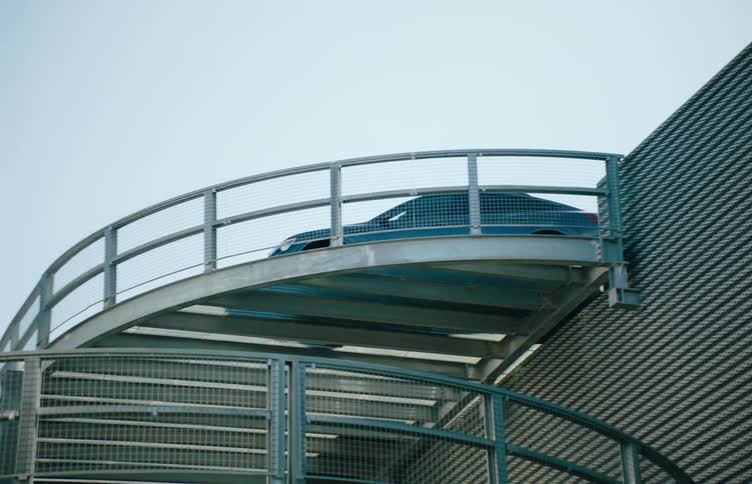 Car descending a metal platform