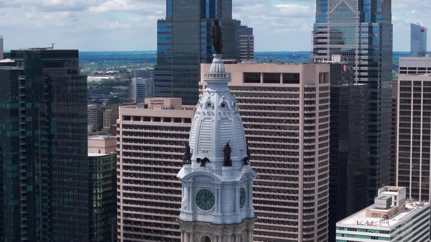 Philadelphia CityHall and William Penn statue  is in the skyline