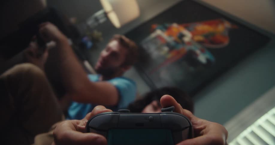 A woman turns from side to side pressing the buttons on the video game controller