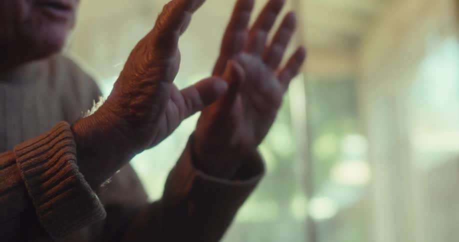 The man is talking and waving his hands