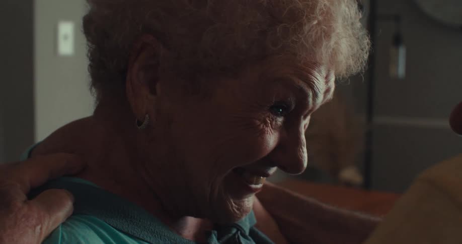Happy elderly people hugging and talking