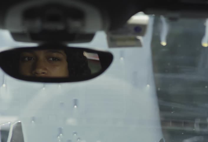 Woman in disbelief as paint falls on her cars windshield