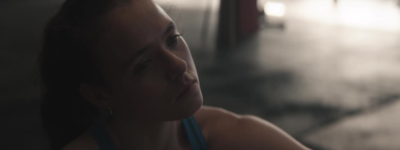 Woman stretching her neck and looking determined
