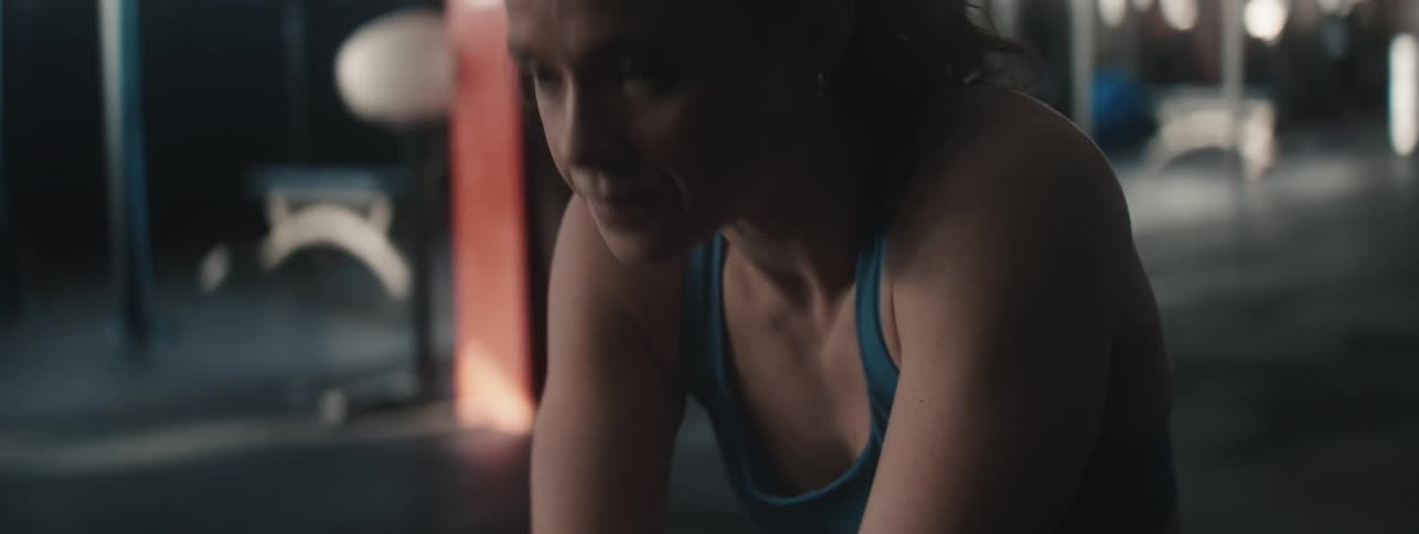 Woman indoors taking deep breaths