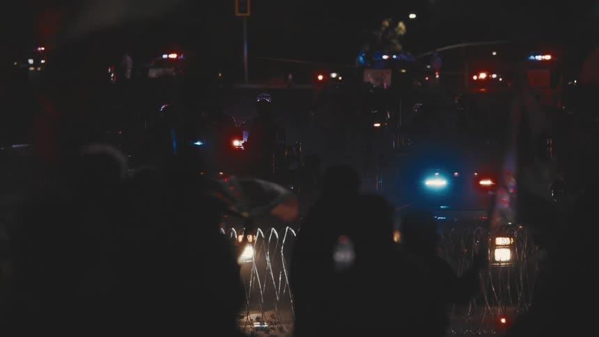 The police have the road blocked with barb wire at night