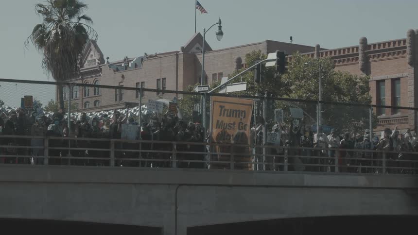 Protesters on an overpass through the city