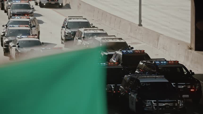 Police cars on a highway through the city
