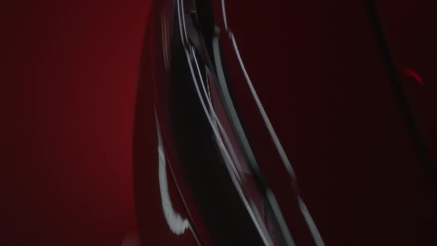 A painted metallic surface reflects light