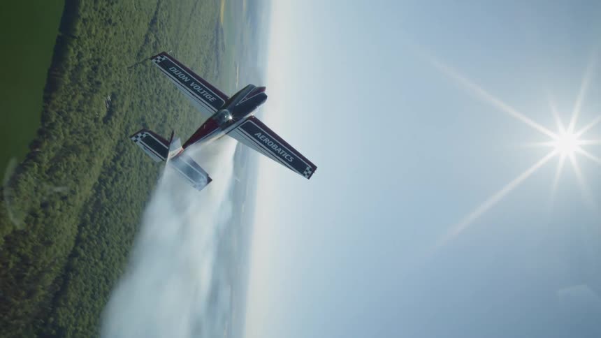 The plane is crop dusting the farm