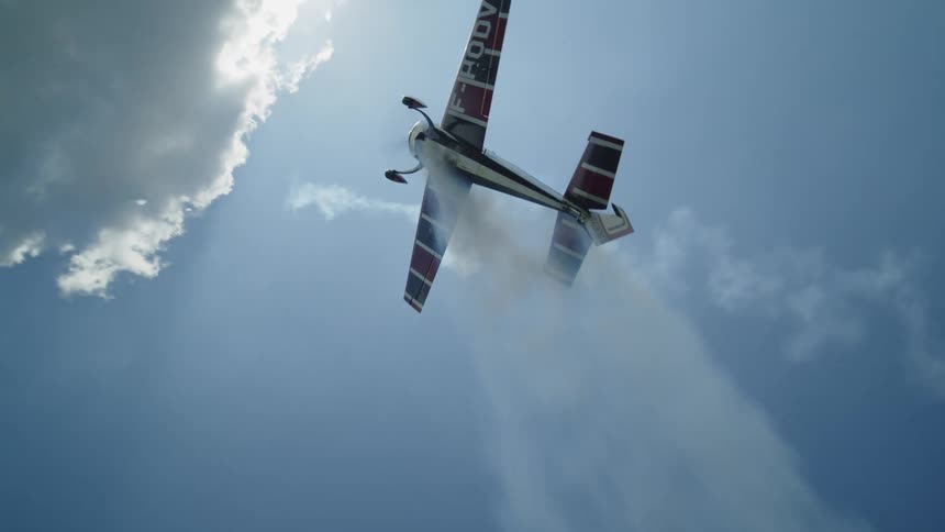 A crop duster flies high over the farm