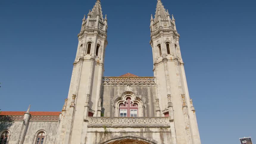 Two bell towers of a church against a blue sky