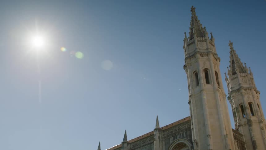 A monument towers into the sunny blue sky