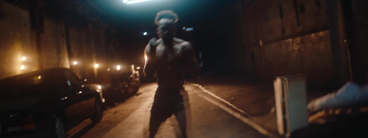 A man is punching and kicking in the tunnel