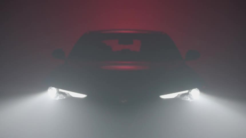 A car's headlights are turned on
