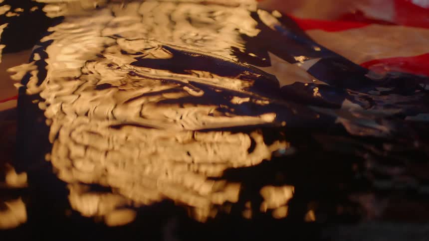 An american flag soaking in water