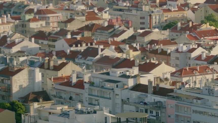 A crowded city with red roofed buildings