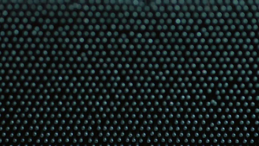 Metal pins arranged in rows shake slightly