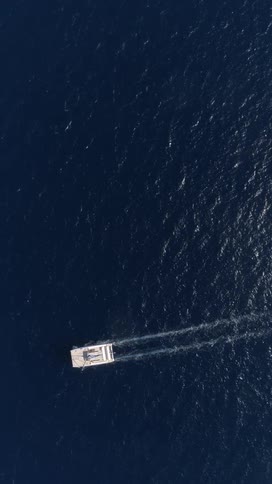 Top view of a boat sailing on an ocean