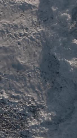 A powerful aerial topdown view captures the chaotic and turbulent motion of churning whitewater rapids