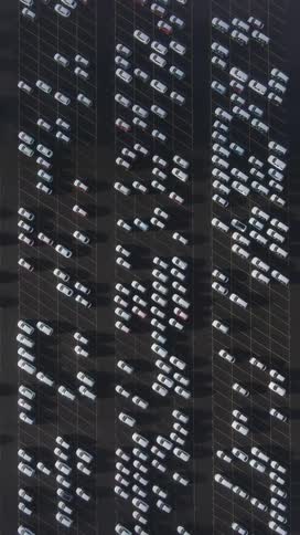 A large parking lot with many cars