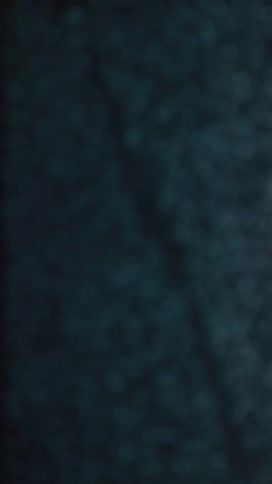 Static fills the screen in a mix of purple blue and pink noise patterns resembling a digital signal glitch or interference