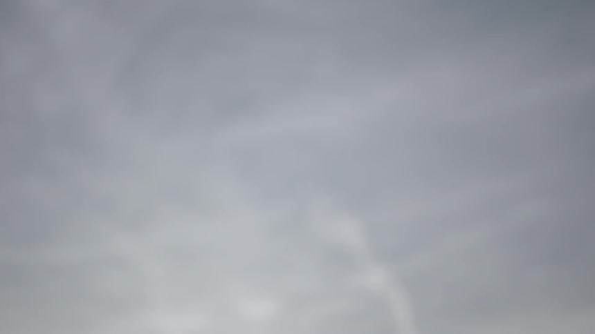 An american flag is waved in the air