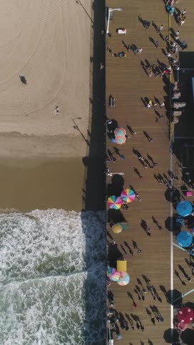 People are walking on the long pier