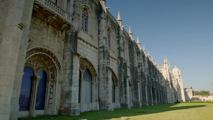 A large building made of stone blocks lays ahead
