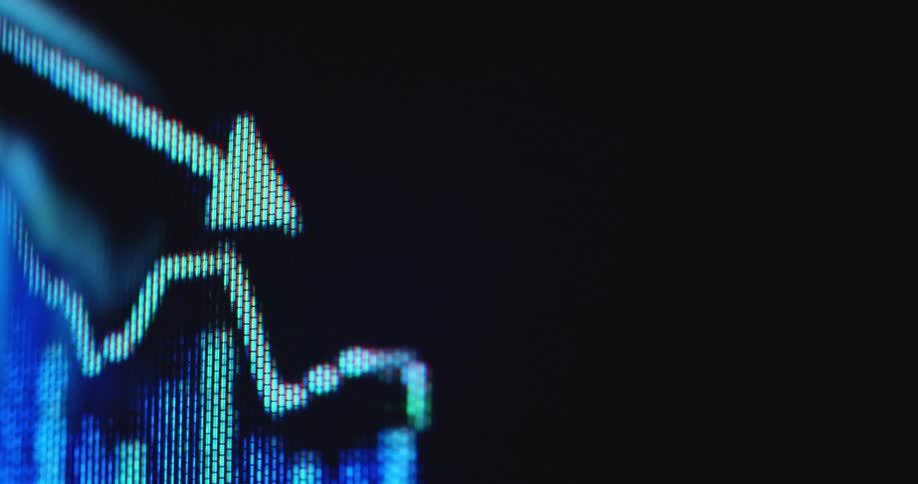 Negative statistical data presented on a pixelated display device as the bars and arrow trend line follow a declining price development symbolizing a failure of the financial system and recession of the global economy