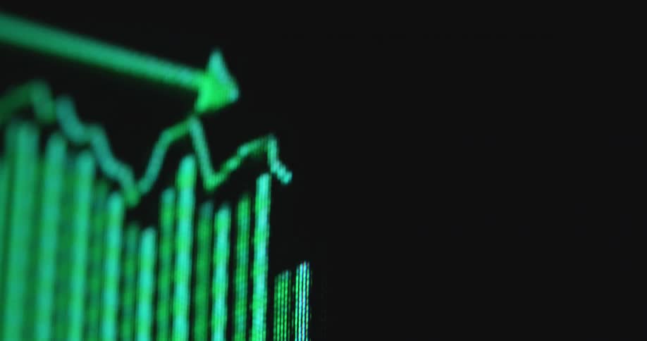 A vibrant green digital graph displays fluctuating diagram consisting of lines and vertical bars with a prominent downward arrow indicating a decline of the Wall Street stock market or global economy with negative price development