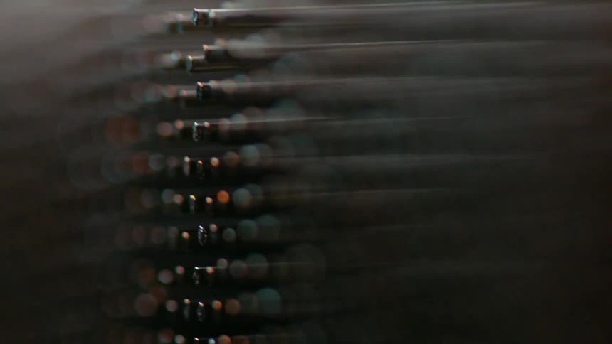 Rows of metal poles are shown