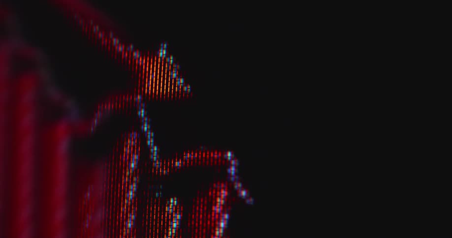 Dynamic hand-held macro shot of pixelated screen showing stock trading chart or financial graph crashing with negative downward tendency falling into the red figures causing stress and panic with fear of economic recession