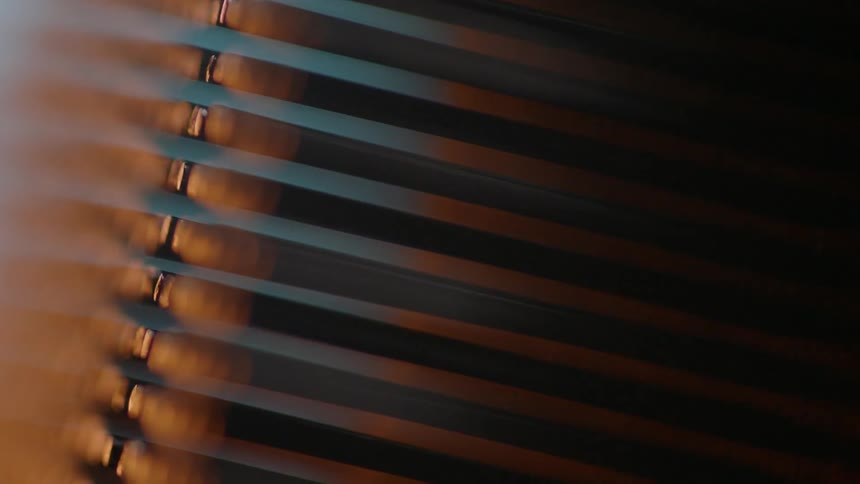 The shade is reflecting lights from outside